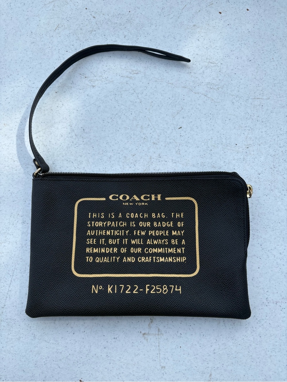 Coach Black Leather Wristlet with Gold Signature Print